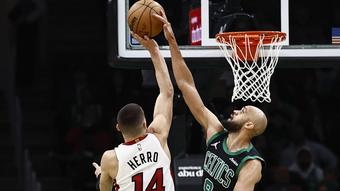 Dec 2, 2024; Boston, Massachusetts, USA; Boston Celtics guard Derrick White (9) blocks a shot by Miami Heat guard Tyler Herro (14) during the second half at TD Garden. Mandatory Credit: Winslow Townson-Imagn Images