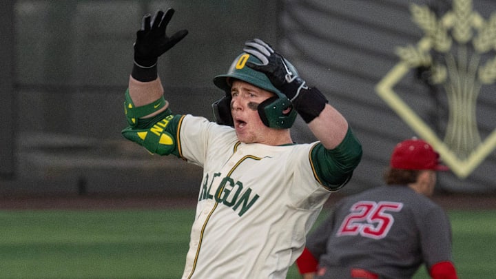 Oregon’s Burke-Lee Mabeus, center, celebrates a double against Indiana in the seventh inning at PK Park in Eugene March 13, 2026.