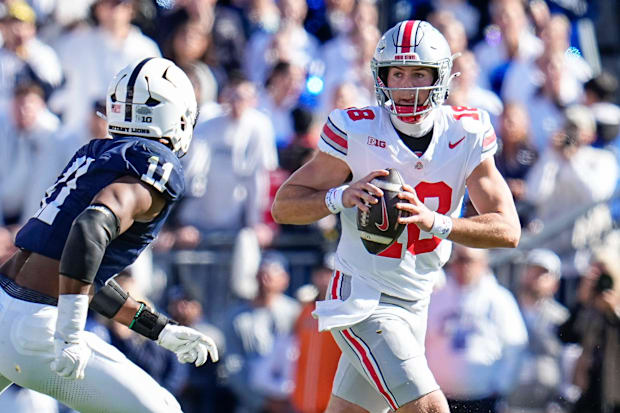 Ohio State Will Howard looks to throw the ball over Abdul Carter against Penn State.
