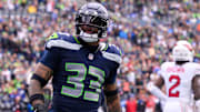 Oct 22, 2023; Seattle, Washington, USA; Seattle Seahawks safety Jamal Adams (33) celebrates after making a play against the Arizona Cardinals during the game at Lumen Field. Mandatory Credit: Steven Bisig-Imagn Images