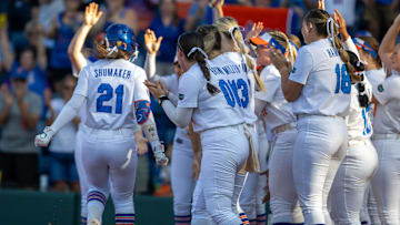 Florida outfielder Taylor Shumaker (21), left, celebrates a home run during an NCAA softball game against Alabama at Katie Seashole Pressly Stadium in Gainesville, FL on Friday, April 18, 2025. Florida won 12-4 in the fifth inning. [Alan Youngblood/Gainesville Sun