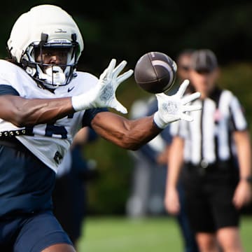 Penn State tight end Khalil Dinkins catches a pass during practice at Holuba Hall.