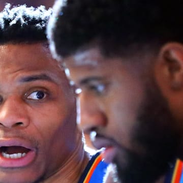 Mar 2, 2018; Phoenix, AZ, USA; Oklahoma City Thunder guard Russell Westbrook (left) talks with forward Paul George against the Phoenix Suns at Talking Stick Resort Arena. Mandatory Credit: Mark J. Rebilas-Imagn Images