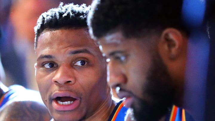 Mar 2, 2018; Phoenix, AZ, USA; Oklahoma City Thunder guard Russell Westbrook (left) talks with forward Paul George against the Phoenix Suns at Talking Stick Resort Arena. Mandatory Credit: Mark J. Rebilas-Imagn Images