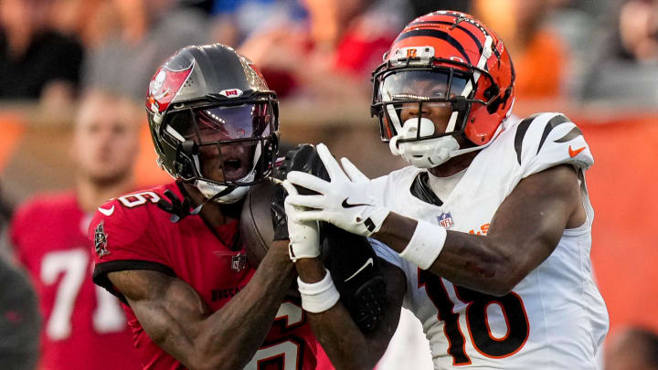 Tampa Bay Buccaneers cornerback Keenan Isaac (16) intercepts a pass intended for Cincinnati Bengals wide receiver Kwamie Lassiter II (18) in the second quarter of the NFL Preseason Week 1 game between the Cincinnati Bengals and the Tampa Bay Buccaneers at Paycor Stadium in downtown Cincinnati on Saturday, Aug. 10, 2024.