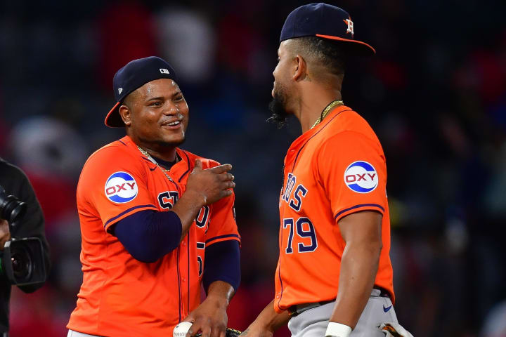 Jun 7, 2024; Anaheim, California, USA; Houston Astros pitcher Framber Valdez (59) and first baseman Jose Abreu (79) celebrate the victory against the Los Angeles Angels at Angel Stadium. Mandatory Credit: Gary A. Vasquez-USA TODAY Sports