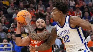 Mar 23, 2025; Milwaukee, WI, USA;  Illinois Fighting Illini guard Kylan Boswell (4) controls the ball against Kentucky Wildcats center Amari Williams (22) during the second half in the second round of the NCAA Tournament at Fiserv Forum. Mandatory Credit: Jeff Hanisch-Imagn Images