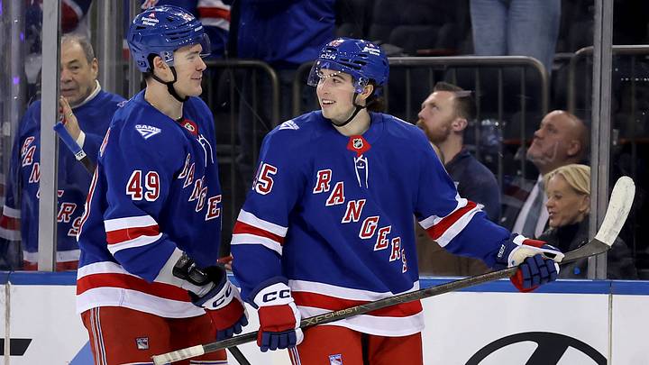 Mar 27, 2026; New York, New York, USA; New York Rangers defenseman Drew Fortescue (45) reacts with right wing Jaroslav Chmelar (49) after a goal by left wing Alexis Lafreniere (not pictured) during the third period at Madison Square Garden. Fortescue recorded an assist on the goal, his first NHL point. Mandatory Credit: Brad Penner-Imagn Images