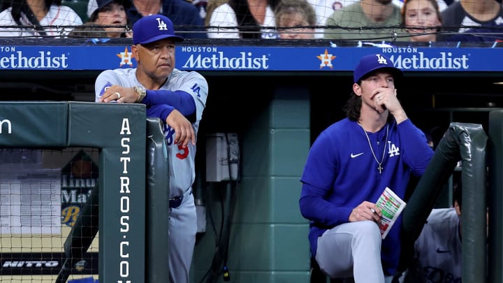 Jul 28, 2024; Houston, Texas, USA; Los Angeles Dodgers manager Dave Roberts (30) watches the action from the dugout against the Houston Astros during the eighth inning at Minute Maid Park. Mandatory Credit: Erik Williams-USA TODAY Sports