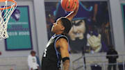 Darius Acuff Jr. from IMG Academy dunks against Oak Ridge during the third place game at the City of Palms Classic at Suncoast Credit Union Arena in Fort Myers on Monday, Dec. 23, 2024. IMG won.