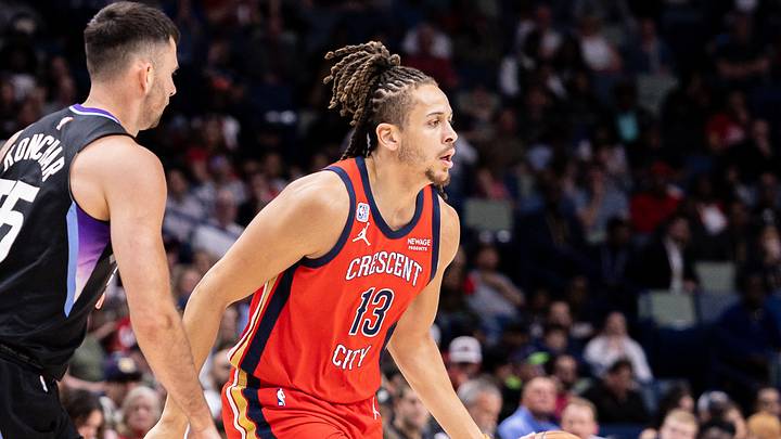 Apr 7, 2026; New Orleans, Louisiana, USA; New Orleans Pelicans guard Josh Oduro (13) dribbles against Utah Jazz guard John Konchar (55) during the first half at Smoothie King Center. Mandatory Credit: Stephen Lew-Imagn Images