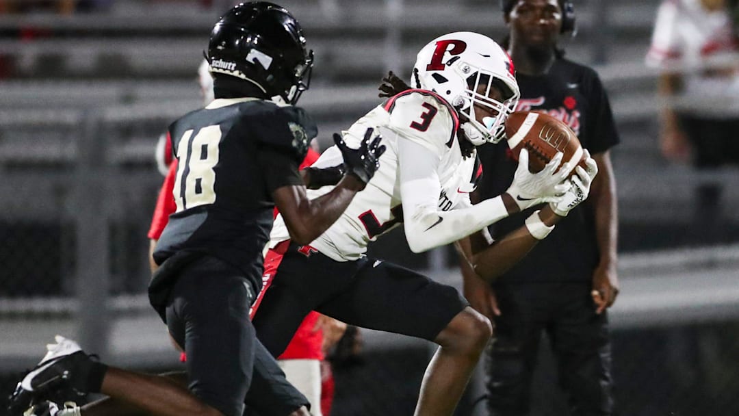 Palmetto Tigers receiver Nazir Pitchford (3) catches a pass while being defended by Gateway Eagles defensive back Jamelle Robertson (18) during the second quarter of a district game at Gateway High School in Fort Myers on Monday, Sept. 30, 2024. Palmetto Tigers receiver Nazir Pitchford (3) catches a pass while being defended by Gateway Eagles defensive back Jamelle Robertson (18) during the second quarter of a district game at Gateway High School in Fort Myers on Monday, Sept. 30, 2024.