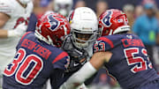 Arizona Cardinals wide receiver Greg Dortch is tackled by Houston Texans safety DeAndre Houston-Carson