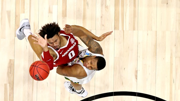 March 29, 2021; Indianapolis, Indiana, United States; Arkansas Razorbacks forward Justin Smith (0) shoots the ball against the Baylor Bears g