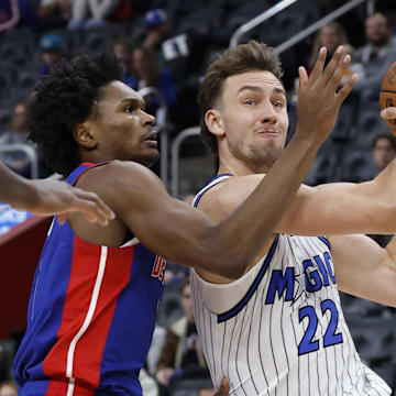 Oct 29, 2025; Detroit, Michigan, USA; Orlando Magic forward Franz Wagner (22) is defended by Detroit Pistons guard Ausar Thompson (9) in the first half at Little Caesars Arena. Mandatory Credit: Rick Osentoski-Imagn Images