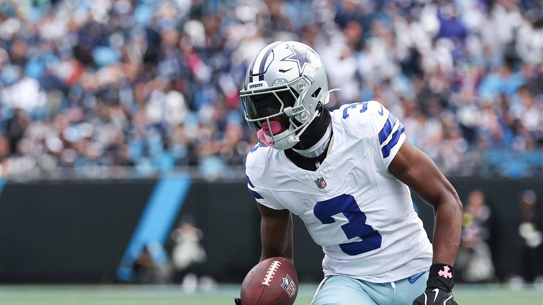 Dallas Cowboys wide receiver George Pickens runs with the ball during the first quarter against the Carolina Panthers at Bank of America Stadium. 
