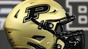 A Purdue Boilermakers helmet is displayed