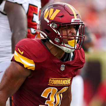 Sep 8, 2024; Tampa, Florida, USA; Washington Commanders running back Austin Ekeler (30) reacts after a run against the Tampa Bay Buccaneers in the second quarter at Raymond James Stadium. Mandatory Credit: Nathan Ray Seebeck-Imagn Images