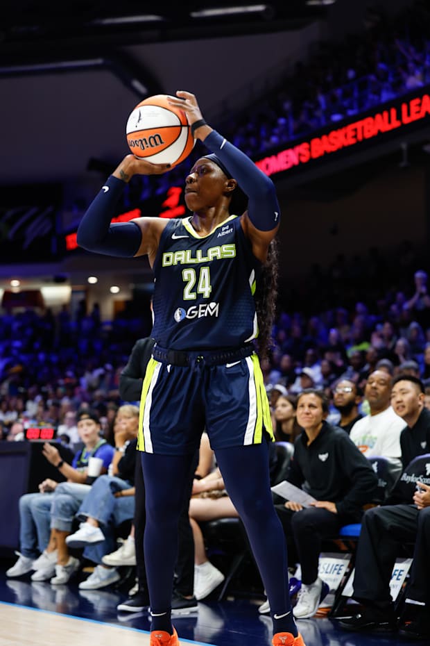 Dallas Wings guard Arike Ogunbowale scores a three-point basket against the Las Vegas Aces