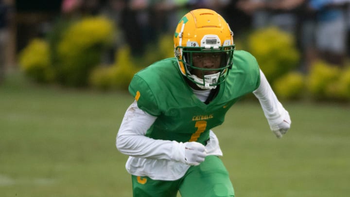 Catholic's Koby Howard (No. 1), one of the area's top prospects, sizes up the competition during Wednesday's Spring football game against Pine Forest.