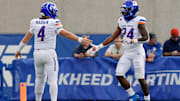 Boise State running back Dylan Riley (24) celebrates with quarterback Maddux Madsen.