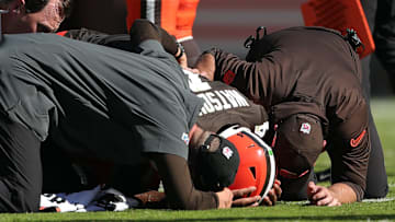 Cleveland Browns quarterback Deshaun Watson is checked on by medical staff after an injury during a game against the Cincinnati Bengals on Oct. 20, 2024, in Cleveland, Ohio.