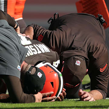 Cleveland Browns quarterback Deshaun Watson is checked on by medical staff after an injury during a game against the Cincinnati Bengals on Oct. 20, 2024, in Cleveland, Ohio.