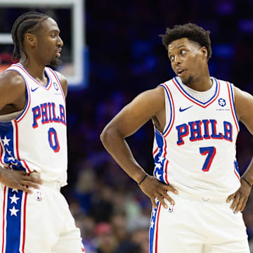 Nov 2, 2024; Philadelphia, Pennsylvania, USA; Philadelphia 76ers guard Tyrese Maxey (0) talks with guard Kyle Lowry (7) during the third quarter against the Memphis Grizzlies at Wells Fargo Center. Mandatory Credit: Bill Streicher-Imagn Images
