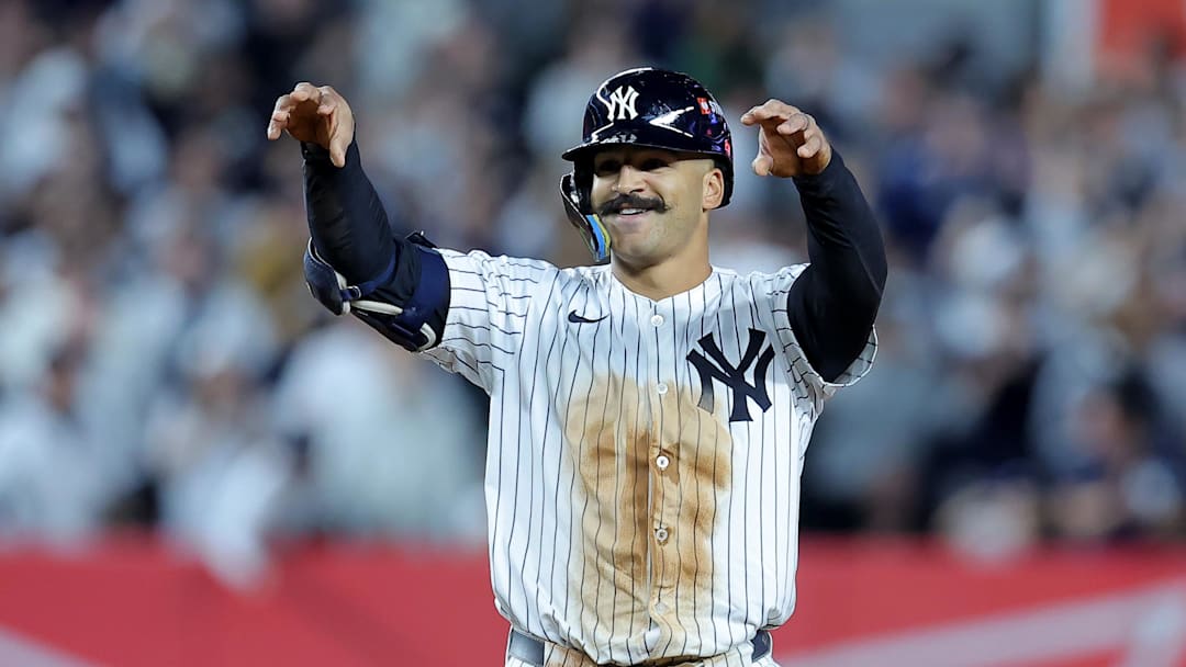 Oct 1, 2025; Bronx, New York, USA; New York Yankees center fielder Trent Grisham (12) celebrates his double against the Boston Red Sox during the seventh inning of game two of the Wildcard round of the 2025 MLB playoffs at Yankee Stadium. Mandatory Credit: Brad Penner-Imagn Images