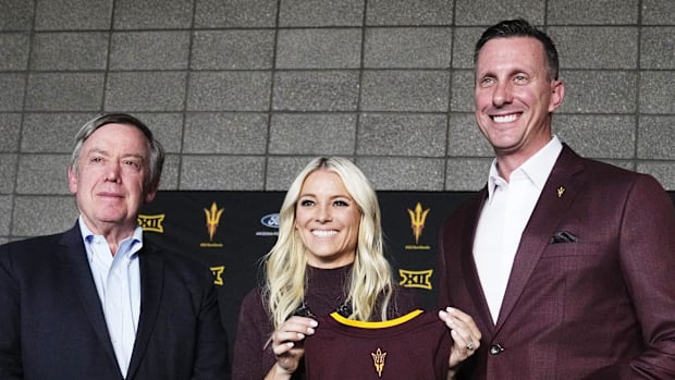 ASU president Michael M. Crow, new women's basketball head coach Molly Miller, and athletic director Graham Rossini (right)