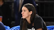 Sep 7, 2025; Baltimore, MD, USA; Indiana Fever guard Caitlin Clark (22) looks on from the bench against the Washington Mystics during the first quarter at CFG Bank Arena. Mandatory Credit: Rafael Suanes-Imagn Images