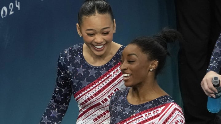 Simone Biles and Sunisa Lee move to their next rotation during the women’s team final at the Paris 2024 Olympic Summer Games at Bercy Arena. 