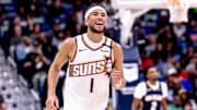 Dec 5, 2024; New Orleans, Louisiana, USA;  Phoenix Suns guard Devin Booker (1) reacts to having foul called against him against the New Orleans Pelicans during the second half  at Smoothie King Center. Mandatory Credit: Stephen Lew-Imagn Images