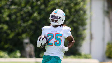 Jun 4, 2024; Miami Gardens, FL, USA; Miami Dolphins running back Jaylen Wright (25) runs with the football during mandatory minicamp at Baptist Health Training Complex. Mandatory Credit: Sam Navarro-USA TODAY Sports