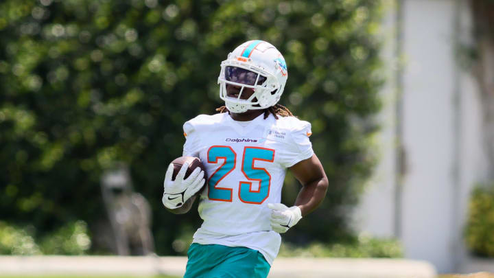 Jun 4, 2024; Miami Gardens, FL, USA; Miami Dolphins running back Jaylen Wright (25) runs with the football during mandatory minicamp at Baptist Health Training Complex. Mandatory Credit: Sam Navarro-USA TODAY Sports