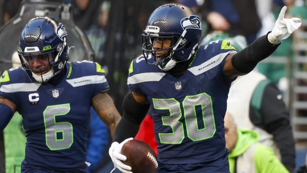 Mike Jackson celebrates an interception against the Jets with Seahawks teammate Quandre Diggs.