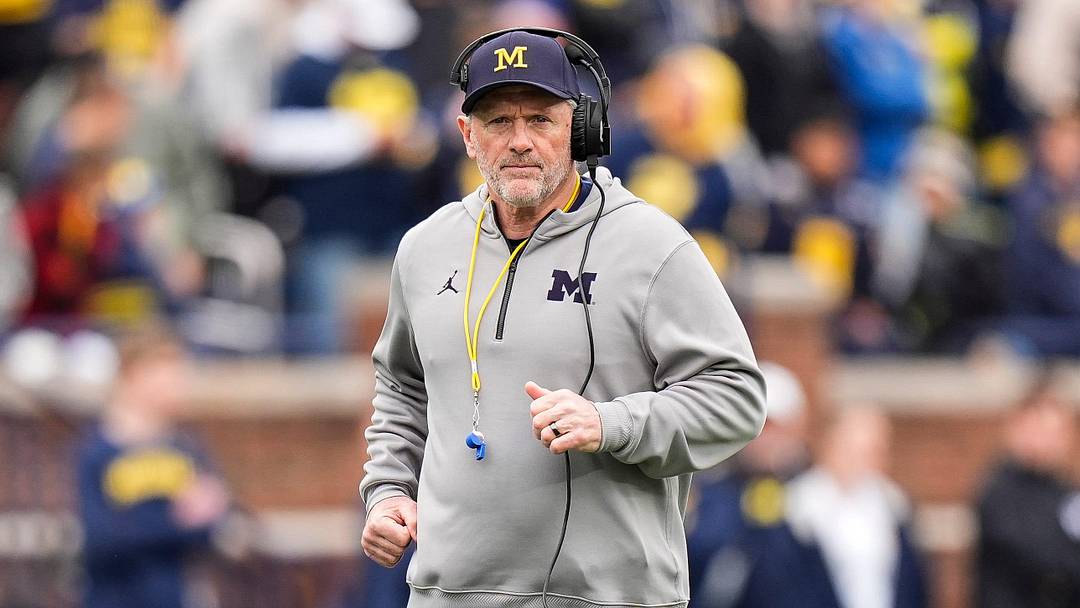 Michigan head coach Kyle Whittingham runs across the field during the spring game at Michigan Stadium in Ann Arbor on Saturday, April 18, 2026.