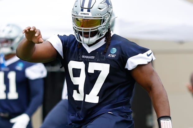 Dallas Cowboys DT Osa Odighizuwa goes through a drill during practice at the Ford Center at the Star Training Facility
