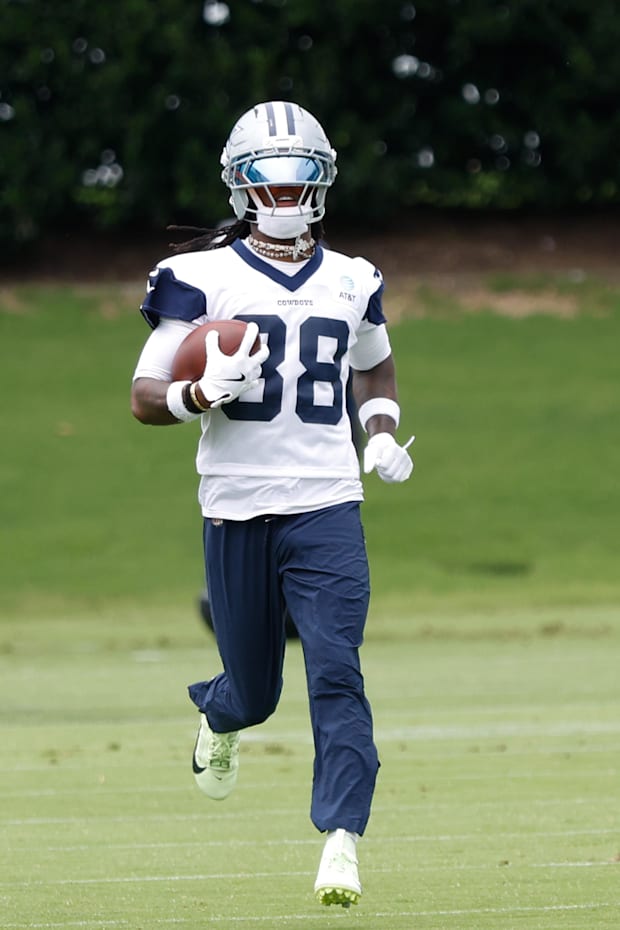 Dallas Cowboys wide receiver CeeDee Lamb goes through a drill during practice