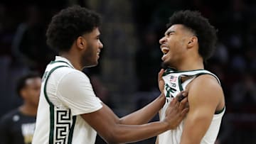Michigan State Spartans guard Jaden Akins, right, is congratulated by guard Jase Richardson (11) after a dunk during the second half of an NCAA Tournament First Round game against the Bryant University Bulldogs at Rocket Arena on Saturday, March 22, 2025, in Cleveland, Ohio.