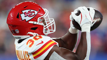 Sep 21, 2025; East Rutherford, New Jersey, USA; Kansas City Chiefs cornerback Christian Roland-Wallace (30) intercepts a pass against the New York Giants in the second quarter at MetLife Stadium. Mandatory Credit: Vincent Carchietta-Imagn Images