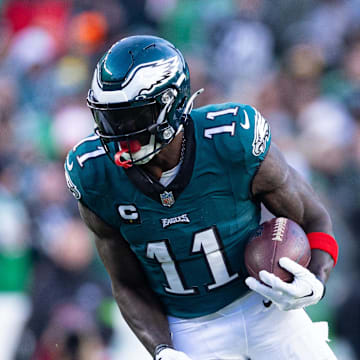 Dec 31, 2023; Philadelphia, Pennsylvania, USA; Philadelphia Eagles wide receiver A.J. Brown (11) runs with the ball during the fourth quarter against the Arizona Cardinals at Lincoln Financial Field. Mandatory Credit: Bill Streicher-Imagn Images