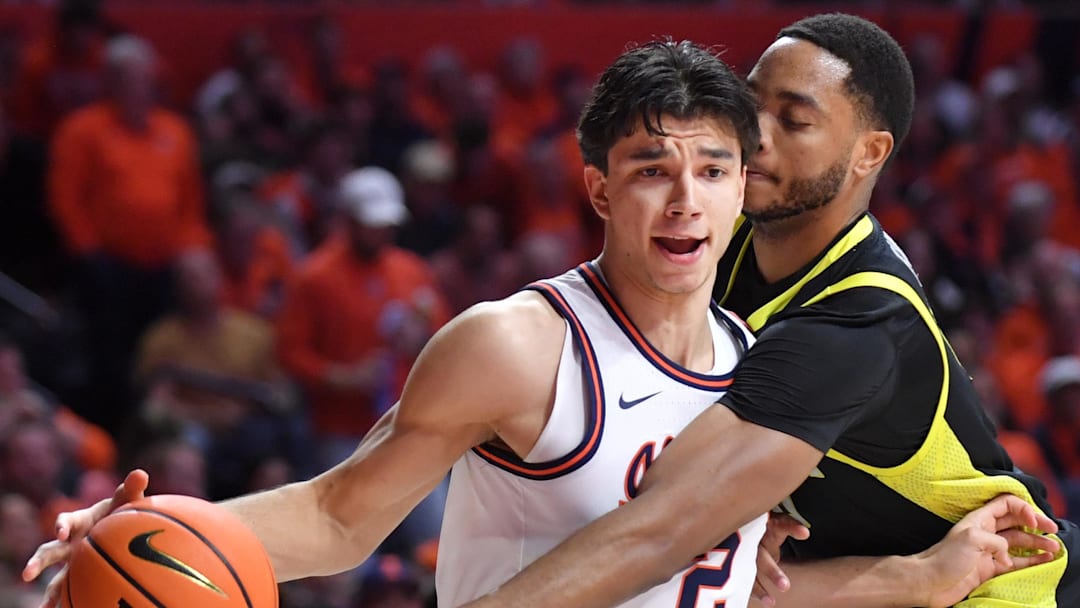 Mar 3, 2026; Champaign, Illinois, USA; Illinois Fighting Illini guard Andrej Stojakovic (2) drives past Oregon Ducks forward Kwame Evans Jr. (10) during the first half at State Farm Center. 