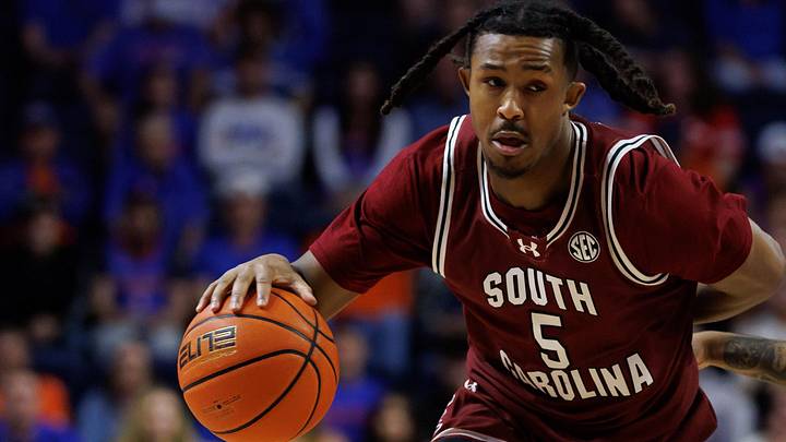 Feb 17, 2026; Gainesville, Florida, USA; South Carolina Gamecocks guard Meechie Johnson (5) drives to the basket while South Carolina Gamecocks forward Elijah Strong (31) screens Florida Gators guard Boogie Fland (0) during the first half at Exactech Arena at the Stephen C. O'Connell Center. Mandatory Credit: Matt Pendleton-Imagn Images