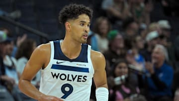 Oct 7, 2025; Minneapolis, Minnesota, USA; Minnesota Timberwolves forward Johnny Juzang (9) follows the play against the Indiana Pacers during the fourth quarter at Target Center. Mandatory Credit: Nick Wosika-Imagn Images