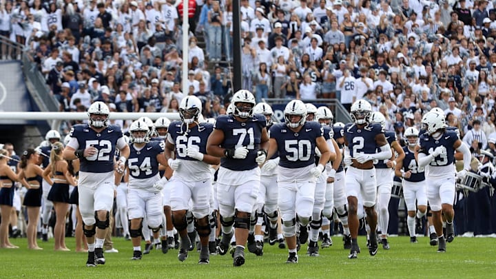 The Penn State Nittany Lions run onto the field prior to the game against the Bowling Green Falcons at Beaver Stadium.