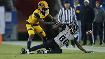 Dec 20, 2019; Frisco, TX, USA; Utah State Aggies wide receiver Siaosi Mariner (80) attempts to catch a pass as Kent State Golden Flashes cornerback Montre Miller (21) defends in the second quarter during the Frisco Bowl at Toyota Stadium. Mandatory Credit: Tim Heitman-USA TODAY Sports