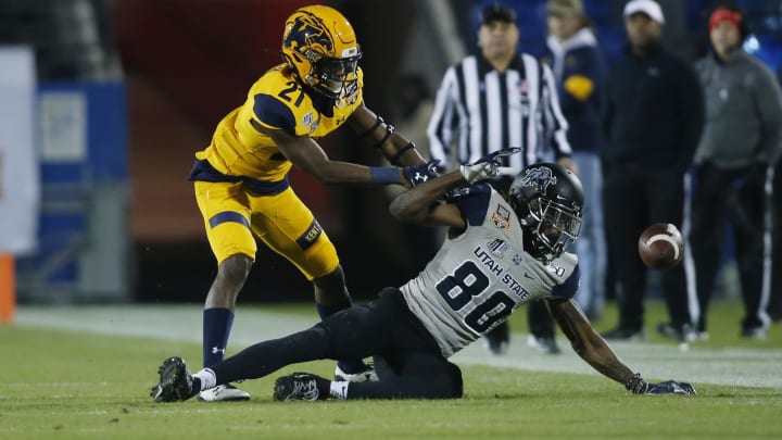 Dec 20, 2019; Frisco, TX, USA; Utah State Aggies wide receiver Siaosi Mariner (80) attempts to catch a pass as Kent State Golden Flashes cornerback Montre Miller (21) defends in the second quarter during the Frisco Bowl at Toyota Stadium. Mandatory Credit: Tim Heitman-USA TODAY Sports