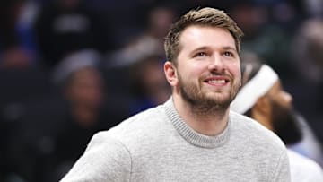 Jan 7, 2025; Dallas, Texas, USA;  Dallas Mavericks guard Luka Doncic laughs during a timeout during the first half against the Los Angeles Lakers at American Airlines Center. Mandatory Credit: Kevin Jairaj-Imagn Images