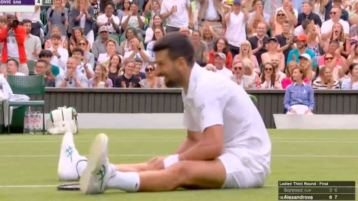 Djokovic was exhausted after an extensive, entertaining rally Djokovic was exhausted after an extensive, entertaining rally